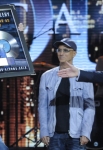 AMERICAN IDOL: Scotty McCreary is presented with a platinum record for CLEAR AS DAY on AMERICAN IDOL airing Thursday, March 29 (8:00-9:00PM ET/PT) on FOX. Pictured L-R: Scoty McCreary, Jimmy Iovine and Ryan Seacrest. CR: Phil Mcarten / FOX.