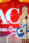 LAS VEGAS, NV - DECEMBER 05: Singer Carrie Underwood accepts the Artist of the Year Award onstage at the American Country Awards 2011 at the MGM Grand Garden Arena on December 5, 2011 in Las Vegas, Nevada. (Photo by Ethan Miller/Getty Images) *** Local Caption *** Carrie Underwood;