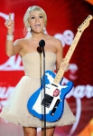 LAS VEGAS, NV - DECEMBER 05: Singer Carrie Underwood accepts the Artist of the Year Award onstage at the American Country Awards 2011 at the MGM Grand Garden Arena on December 5, 2011 in Las Vegas, Nevada. (Photo by Ethan Miller/Getty Images) *** Local Caption *** Carrie Underwood;
