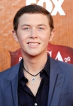 LAS VEGAS, NV - DECEMBER 05: 2011 American Idol Scotty McCreery arrives at the American Country Awards 2011 at the MGM Grand Garden Arena on December 5, 2011 in Las Vegas, Nevada. (Photo by Frazer Harrison/Getty Images) *** Local Caption *** Scotty McCreery;