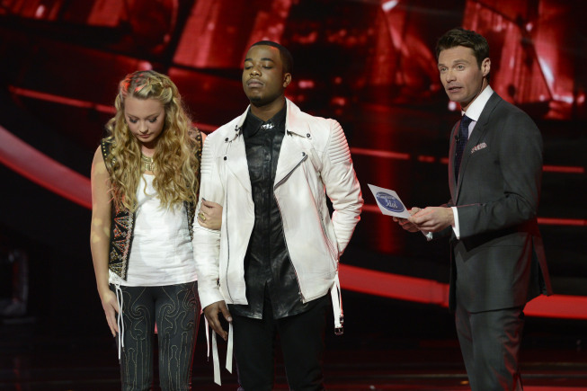 AMERICAN IDOL: Burnell Taylor is eliminated on AMERICAN IDOL Thursday, April 4 (8:00-9:00 PM ET/PT) on FOX. Pictured L-R: Janelle Arthur, Burnell Taylor and Ryan Seacrest. CR: Michael Becker / FOX. Copyright: FOX.