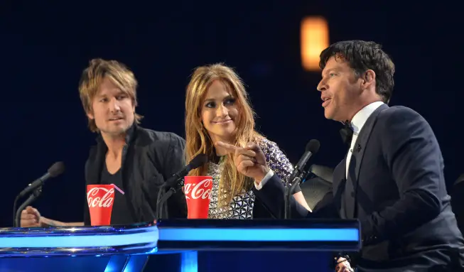 AMERICAN IDOL XIII: L-R: Keith Urban, Jennifer Lopez and Harry Conicck, Jr, on AMERICAN IDOL XIII at the NOKIA THEATRE L.A. LIVE airing Tuesday, May 20 (8:00-10:00 PM ET / PT) on FOX. CR: Michael Becker / FOX. Copyright 2014 / FOX Broadcasting.