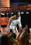 AMERICAN IDOL XIII: Ryan Seacrest on AMERICAN IDOL XIII at the NOKIA THEATRE L.A. LIVE airing Tuesday, May 20 (8:00-10:00 PM ET / PT) on FOX. CR: Michael Becker / FOX. Copyright 2014 / FOX Broadcasting.
