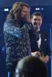 AMERICAN IDOL XIII: Caleb Johson is crowned the AMERICAN IDOL at the NOKIA THEATRE L.A. LIVE on Wednesday, May 21 (8:00-10:00 PM ET/PT) on FOX. L-R: Caleb Johnson and Ryan Seacrest. CR: Michael Becker/FOX.
