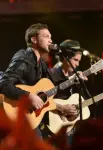 AMERICAN IDOL XIII: AMERICAN IDOL XIII top ten finalist Sam Woolf and Season 11 American Idol Phillip Phillips perform a medley of hits live during the AMERICAN IDOL XIII at the Nokia Theatre on Wednesday. May 21 in Los Angeles, California. CR: Michael Becker/FOX