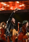 AMERICAN IDOL XIII: AMERICAN IDOL XIII top ten finalist Sam Woolf and Season 11 American Idol Phillip Phillips perform a medley of hits live during the AMERICAN IDOL XIII at the Nokia Theatre on Wednesday. May 21 in Los Angeles, California. CR: Michael Becker/FOX
