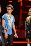 AMERICAN IDOL XIII: L-R: Ryan Seacrest, Sam Woolf and Ariana Grande perform on AMERICAN IDOL XIII airing Thursday, April 30 (8:00-10:00 PM ET / PT) on FOX. CR: Michael Becker / FOX. Copyright 2014 / FOX Broadcasting.