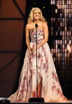 NASHVILLE, TN - NOVEMBER 09: Co host Carrie Underwood speaks at the 45th annual CMA Awards at the Bridgestone Arena on November 9, 2011 in Nashville, Tennessee. (Photo by Rick Diamond/Getty Images) *** Local Caption *** Carrie Underwood;