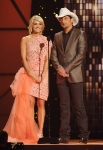 NASHVILLE, TN - NOVEMBER 09: Hosts Carrie Underwood and Brad Paisley speak at the 45th annual CMA Awards at the Bridgestone Arena on November 9, 2011 in Nashville, Tennessee. (Photo by Rick Diamond/Getty Images) *** Local Caption *** Carrie Underwood;Brad Paisley;