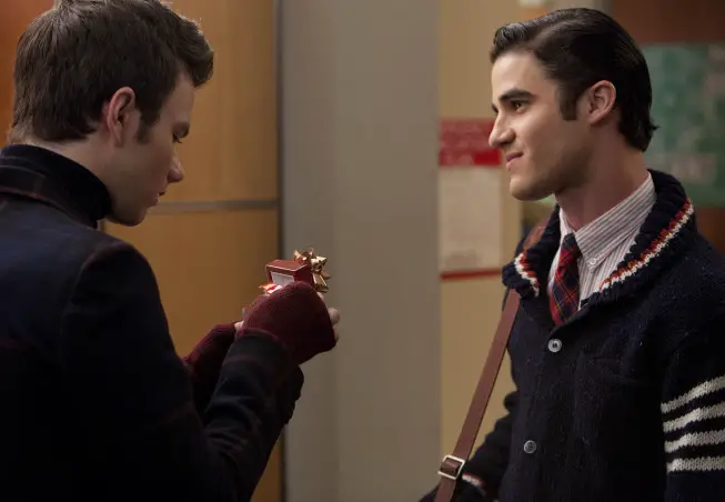 GLEE: Blaine (Darren Criss, R) gives Kurt (Chris Colfer, L) a gift in the "Extraordinary Merry Christmas" episode of GLEE airing Tuesday, Dec. 13 (8:00-9:00 PM ET/PT) on FOX. ©2011 Fox Broadcasting Co. Cr: Adam Rose/FOX
