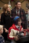 GLEE: Emma (Jayma Mays, L), Will (Matthew Morrison, R) and Artie (Kevin McHale, C) bring gifts to a children's homeless center in the "Extraordinary Merry Christmas" episode of GLEE airing Tuesday, Dec. 13 (8:00-9:00 PM ET/PT) on FOX. ©2011 Fox Broadcasting Co. Cr: Adam Rose/FOX