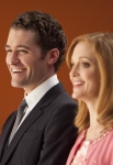GLEE: Will (Matthew Morrison, L) and Emma (Jayma Mays, R) watch sectionals in the "Hold on to Sixteen" episode of GLEE airing Tuesday, Dec. 6 (8:00-9:00 PM ET/PT) on FOX. ©2011 Fox Broadcasting Co. Cr: Adam Rose/FOX