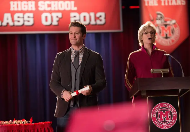 GLEE: Will (Matthew Morrison, L) and Sue (Jane Lynch, R) graduate the class of 2013 in the "New Directions" episode of GLEE airing Tuesday, March 25 (9:00-10:00 PM ET/PT) on FOX. Â©2014 Broadcasting Co. CR: Eddy Chen/FOX