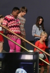 GLEE: Will (Matthew Morrison, R) and April Rhodes (guest star Kristin Chenoweth, red dress) take the kids to NAME in the "New Directions" episode of GLEE airing Tuesday, March 25 (9:00-10:00 PM ET/PT) on FOX. Â©2014 Broadcasting Co. CR: Mike Yarish/FOX