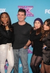 THE X FACTOR: Simon Cowell with Fifth Harmony at THE X FACTOR Final Three Red Carpet and Press Conference, Monday, Dec. 17 in Los Angeles, CA. CR: Ray Mickshaw / FOX.