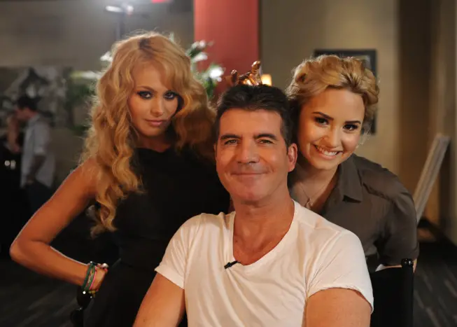 THE X FACTOR: June 11, 2013: L-R: Paulina Rubio, Simon Cowell and Demi Lovato backstage on the THE X FACTOR set in New Orleans. THE X FACTOR airs this Fall on FOX. CR: Ray Mickshaw / FOX. Â© Copyright 2013 / FOX.