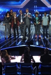 THE X FACTOR: Top 10 to 9 Elimination: Host Steve Jones (C) and the top 10 contestants stand before the judges on THE X FACTOR airing Thursday, Nov. 17 (8:00-9:00 PM ET/PT) on FOX. CR: Ray Mickshaw / FOX.