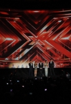 THE X FACTOR: (L-R) Simon Cowell, Paula Abdul, L.A. Reid, Nicole Scherzinger and Steve Jones address the audience at FOX's "The X Factor" World Premiere Screening Event at the Arclight Cinerama Dome on September 14, 2011 in Hollywood, California. The two-night series premiere of THE X FACTOR airs on Wednesday, September 21 (8-10pm ET/PT) and Thursday, September 22 (8-10pm ET/PT) on FOX. (Photo by Mark Davis/PictureGroup)