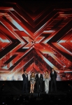THE X FACTOR: (L-R) Simon Cowell, Paula Abdul, L.A. Reid, Nicole Scherzinger and Steve Jones address the audience at FOX's "The X Factor" World Premiere Screening Event at the Arclight Cinerama Dome on September 14, 2011 in Hollywood, California. The two-night series premiere of THE X FACTOR airs on Wednesday, September 21 (8-10pm ET/PT) and Thursday, September 22 (8-10pm ET/PT) on FOX. (Photo by Mark Davis/PictureGroup)