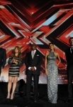 THE X FACTOR: (L-R) Simon Cowell, Paula Abdul, L.A. Reid, Nicole Scherzinger and Steve Jones address the audience at FOX's "The X Factor" World Premiere Screening Event at the Arclight Cinerama Dome on September 14, 2011 in Hollywood, California. The two-night series premiere of THE X FACTOR airs on Wednesday, September 21 (8-10pm ET/PT) and Thursday, September 22 (8-10pm ET/PT) on FOX. (Photo by Mark Davis/PictureGroup)
