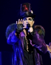 Singer Adam Lambert performs onstage during his "Glam Nation 2010 Tour' at Club Nokia on December 16, 2010 in Los Angeles, California.