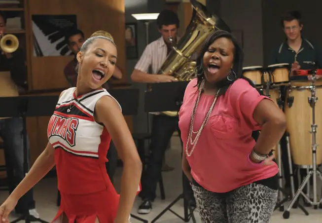 GLEE: Santana (Naya Rivera, L) and Mercedes (Amber Riley, R) perform a duet in the "Duets" episode of GLEE airing Tuesday, Oct. 12 (8:00-9:00 PM ET/PT) on FOX. ©2010 Fox Broadcasting Co. CR: Michael Yarish/FOX