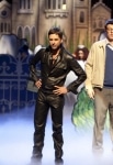 GLEE: Dr. Carl (guest star John Stamos, L) interrupts a performance with FInn (Cory Monteith, C) and Rachel (Lea Michele, R) in "The Rocky Horror Glee Show" episode of GLEE airing Tuesday, Oct. 26 (8:00-9:01 PM ET/PT) on FOX. Â©2010 Fox Broadcasting Co. Cr: Adam Rose/FOX