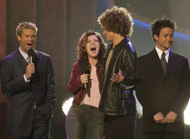 (L-R):Ryan Seacrest, Kelly Clarkson, Justin Guarini and BrianDunkleman find out who is America's Idol Wednesday, Sept. 4, 2002, at the Kodak Theater in Hollywood, CA, on the finale of AMERICAN IDOL:THE SEARCH FOR A SUPERSTAR on FOX. ??2002FOX BROADCASTING CR:Ray Mickshaw/FOX