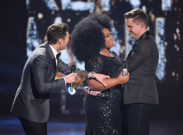 HOLLYWOOD, CA - APRIL 7: Judge Ryan Seacrest (L) announces American Idol Season 15 winner Trent Harmon (R) with runner-up La'Porsha Renae, onstage at FOX's American Idol Season 15 Finale on April 7, 2016 at the Dolby Theatre in Hollywood, California. (Photo by FOX via Getty Images) *** Local Caption *** Ryan Seacrest; La'Porsha Renae; Trent Harmon