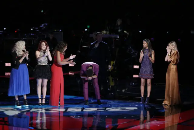 THE VOICE -- "Live Playoffs" Episode 1214A -- Pictured: (l-r) Aaliyah Rose, Casi Joy, Felicia Temple, TSoul, Carson Daly, Aliyah Moulden, Lauren Duski -- (Photo by: Tyler Golden/NBC)