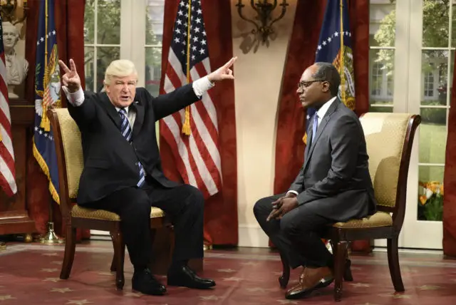 SATURDAY NIGHT LIVE -- "Melissa McCarthy" Episode 1724 -- Pictured: (l-r) Alec Baldwin as President Donald Trump, Michael Che as Journalist Lester Holt during "Lester Holt Cold Open" in Studio 8H on May 13, 2017 -- (Photo by: Will Heath/NBC)