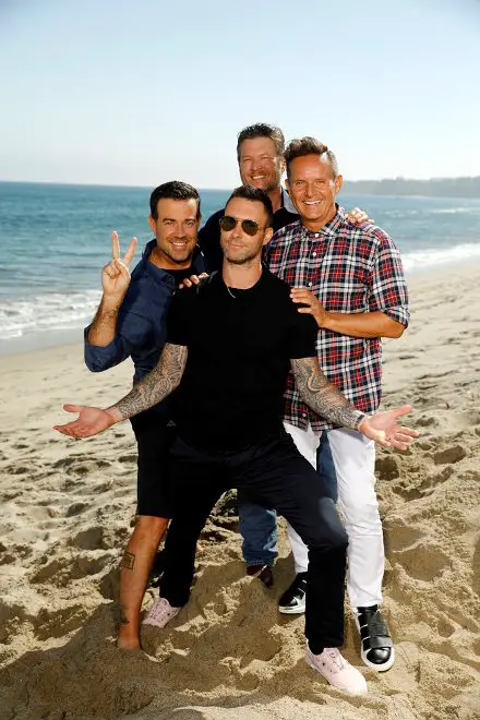 THE VOICE -- "Press Junket" -- The boys on the beach have some fun before returning to ?The Voice,? which begins its 13th season with a two-hour premiere on Monday, Sept. 25 at 8 p.m. ET/PT. Host Carson Daly, left, coach Blake Shelton and executive producer Mark Burnett flank coach Adam Levine -- (Photo by: Trae Patton/NBC)