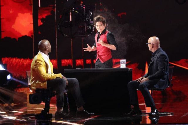 AMERICA'S GOT TALENT: THE CHAMPIONS -- "The Champions Finals" Episode 106 -- Pictured: (l-r) Terry Crews, Shin Lim, Howie Mandel -- (Photo by: Jordin Althaus/NBC)