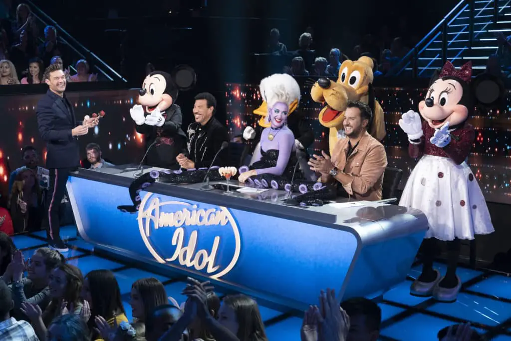 AMERICAN IDOL - "214 (Disney Night)" - "American Idol"'s Top 10 contestants head to The Happiest Place On Earth, Disneyland Park in Anaheim, California, to prepare for the next phase of the competition, Disney Night. The finalists will be joined by celebrity mentor Rebel Wilson, who will offer up her pitch-perfect expertise as the superstar hopefuls prepare for their Disney-themed performances. All-star judges Katy Perry, Luke Bryan and Lionel Richie will perform a timeless Disney song in Disneyland Park's Fantasyland. The Top 10 will then return to the iconic Idol stage in Los Angeles to perform fan-favorite Disney songs, in hopes of winning America's heart and vote for a spot in the Top 8. Joining the Top 10 to perform the beloved song "Part of Your World" from Disney's "The Little Mermaid" is singer and actress Lea Michele. Also, America's sweethearts, ABC's Season 1 "American Idol" winner, Maddie Poppe, and runner-up Caleb Lee Hutchinson, return to the stage to sing a Disney classic during a special duet performance. The magic takes place SUNDAY, APRIL 21 (8:00-10:01 p.m. EDT/5:00-7:01 p.m. PDT), on The ABC Television Network. (ABC/Eric McCandless) RYAN SEACREST, MICKEY MOUSE, LIONEL RICHIE, DONALD DUCK, KATY PERRY, PLUTO, LUKE BRYAN, MINNIE MOUSE
