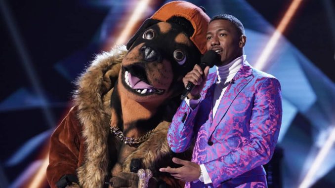 THE MASKED SINGER: L-R: The Rottweiler and host Nick Cannon in the all-new ?Mask Us Anything? episode of THE MASKED SINGER airing Wednesday, Nov. 6 (8:00-9:00 PM ET/PT) on FOX. © 2019 FOX MEDIA LLC. CR: Jack Zeman / FOX.