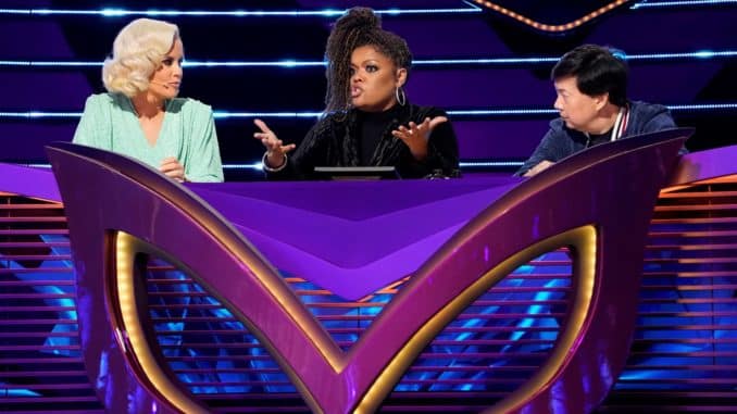 THE MASKED SINGER: L-R: Jenny McCarthy, guest panelist Yvette Nicole Brown and Ken Jeong in the all-new “The Mother Of All Final Face Offs, Part 1” episode of THE MASKED SINGER airing Wednesday, April 8 (8:00-9:01 PM ET/PT) on FOX. CR: Michael Becker / FOX. © 2020 FOX Media LLC.