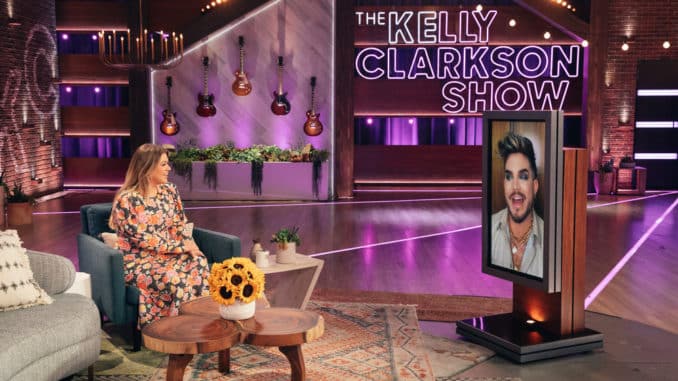 THE KELLY CLARKSON SHOW -- Episode 4090 -- Pictured: (l-r) Kelly Clarkson, Adam Lambert (on screen) -- (Photo by: Weiss Eubanks/NBCUniversal)