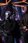 THE MASKED SINGER: L-R: Raven and host Nick Cannon in the "New Masks on the Block" episode of  THE MASKED SINGER airing Wednesday, Jan. 9 (9:00-10:00 PM ET/PT) on FOX. © 2019 FOX Broadcasting. CR: Michael Becker / FOX.