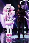 THE MASKED SINGER: L-R: Poodle and host Nick Cannon in the "New Masks on the Block" episode of  THE MASKED SINGER airing Wednesday, Jan. 9 (9:00-10:00 PM ET/PT) on FOX. © 2019 FOX Broadcasting. CR: Michael Becker / FOX.