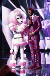 THE MASKED SINGER: L-R: Poodle and host Nick Cannon in the “Another Mask Bites the Dust” airing Wednesday, Jan. 23 (9:00-10:00 PM ET/PT) on FOX. © 2019 FOX Broadcasting.  Cr: Michael Becker / FOX.