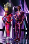 THE MASKED SINGER: L-R: Alien and host Nick Cannon in the “Another Mask Bites the Dust” airing Wednesday, Jan. 23 (9:00-10:00 PM ET/PT) on FOX. © 2019 FOX Broadcasting.  Cr: Michael Becker / FOX.