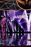 THE MASKED SINGER: L-R: Alien and host Nick Cannon in the “Another Mask Bites the Dust” airing Wednesday, Jan. 23 (9:00-10:00 PM ET/PT) on FOX. © 2019 FOX Broadcasting.  Cr: Michael Becker / FOX.
