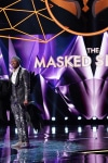 THE MASKED SINGER: L-R: Raven and host Nick Cannon in the “Touchy Feely Clues” episode of THE MASKED SINGER airing Wednesday, Feb. 6 (9:00-10:00 PM ET/PT) on FOX. © 2019 FOX Broadcasting. CR: Michael Becker / FOX.