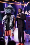 THE MASKED SINGER: L-R: Hippo and host Nick Cannon in the "Mask On Face Off" series premiere of THE MASKED SINGER airing Wednesday, Jan 2 (9:00-10:00 PM ET/PT) on FOX. © 2019 FOX Broadcasting.  CR: Michael Becker / FOX.