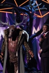 THE MASKED SINGER: L-R: Deer and host Nick Cannon in the "Mask On Face Off" series premiere of THE MASKED SINGER airing Wednesday, Jan 2 (9:00-10:00 PM ET/PT) on FOX. © 2019 FOX Broadcasting.  CR: Michael Becker / FOX.